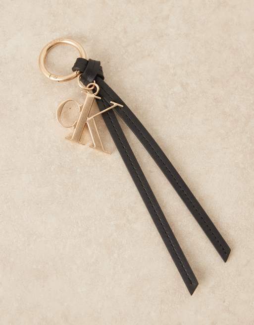 Calvin Klein Jeans monogram tassel bag charm in black , 2 of 3