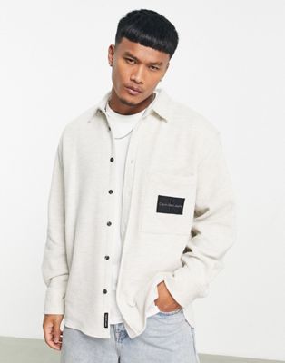 Calvin Klein Jeans monologo badge oversized fit knitted shirt in white marl