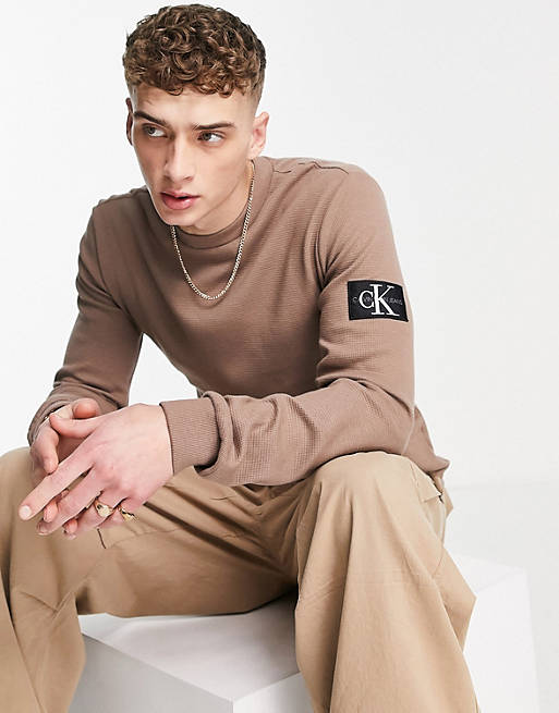 Calvin Klein Jeans monologo badge waffle slim fit long sleeve top in tan |  ASOS