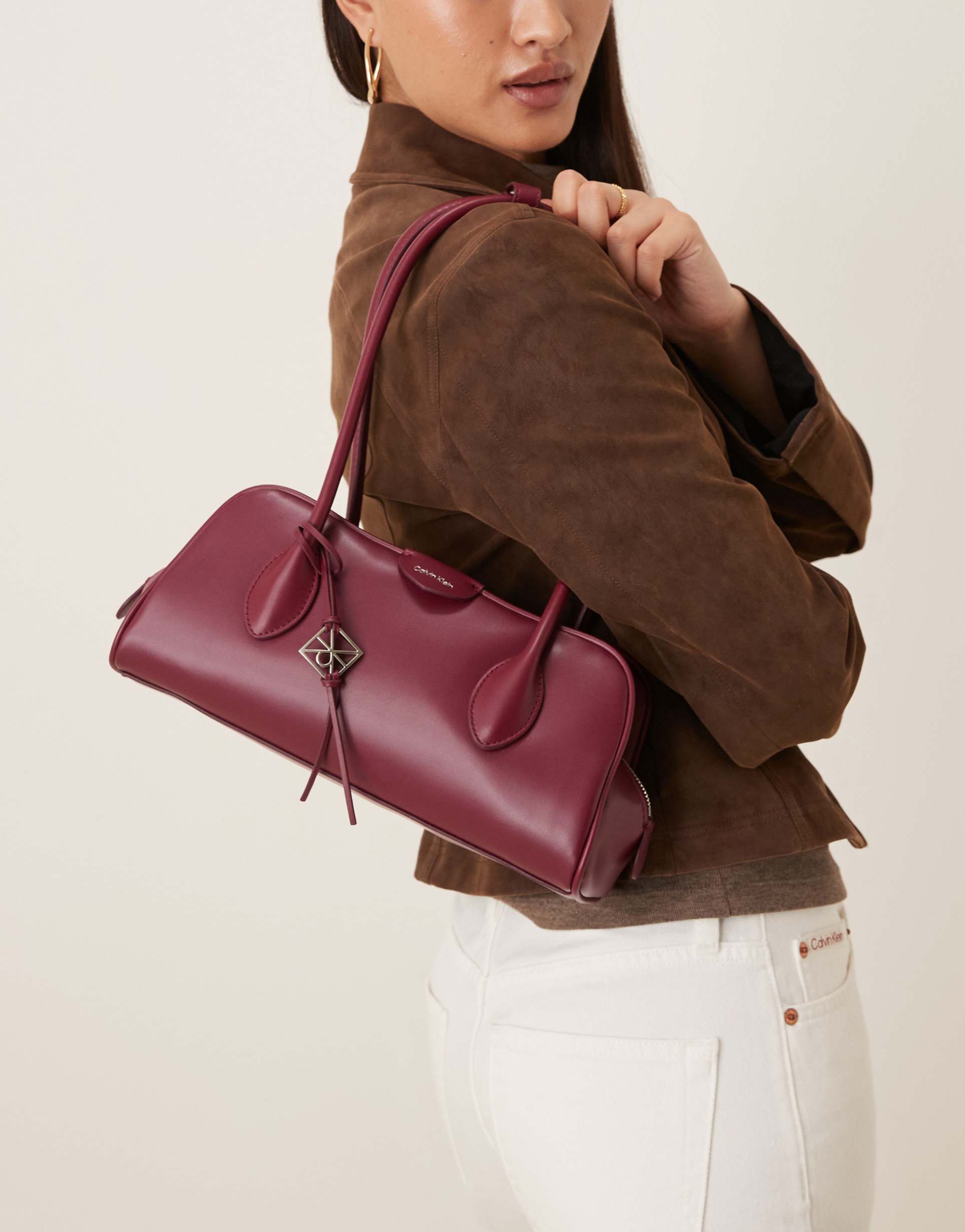 calvin klein jeans multi compartment shoulder bag in pink