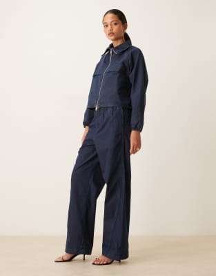 Calvin Klein Jeans - Pantalon parachute d'ensemble en denim de nylon - Bleu marine foncé