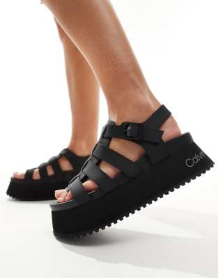 Calvin Klein Jeans - Plateau-Römersandalen in Schwarz