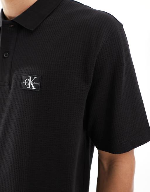 Calvin Klein Jeans Polo taglio comodo nera testurizzata ASOS