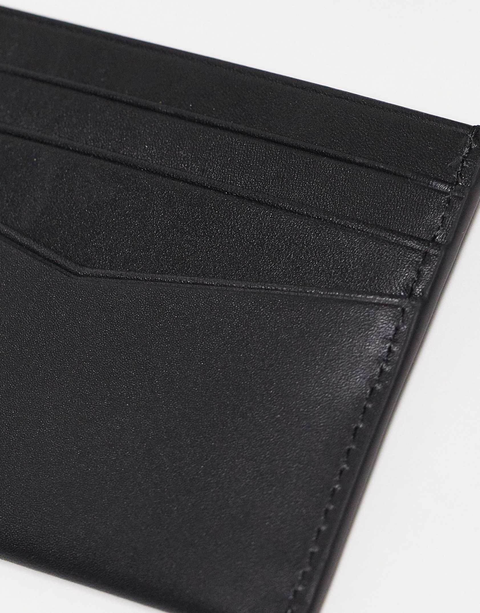 Calvin Klein Jeans leather card holder in black -  Price Checker