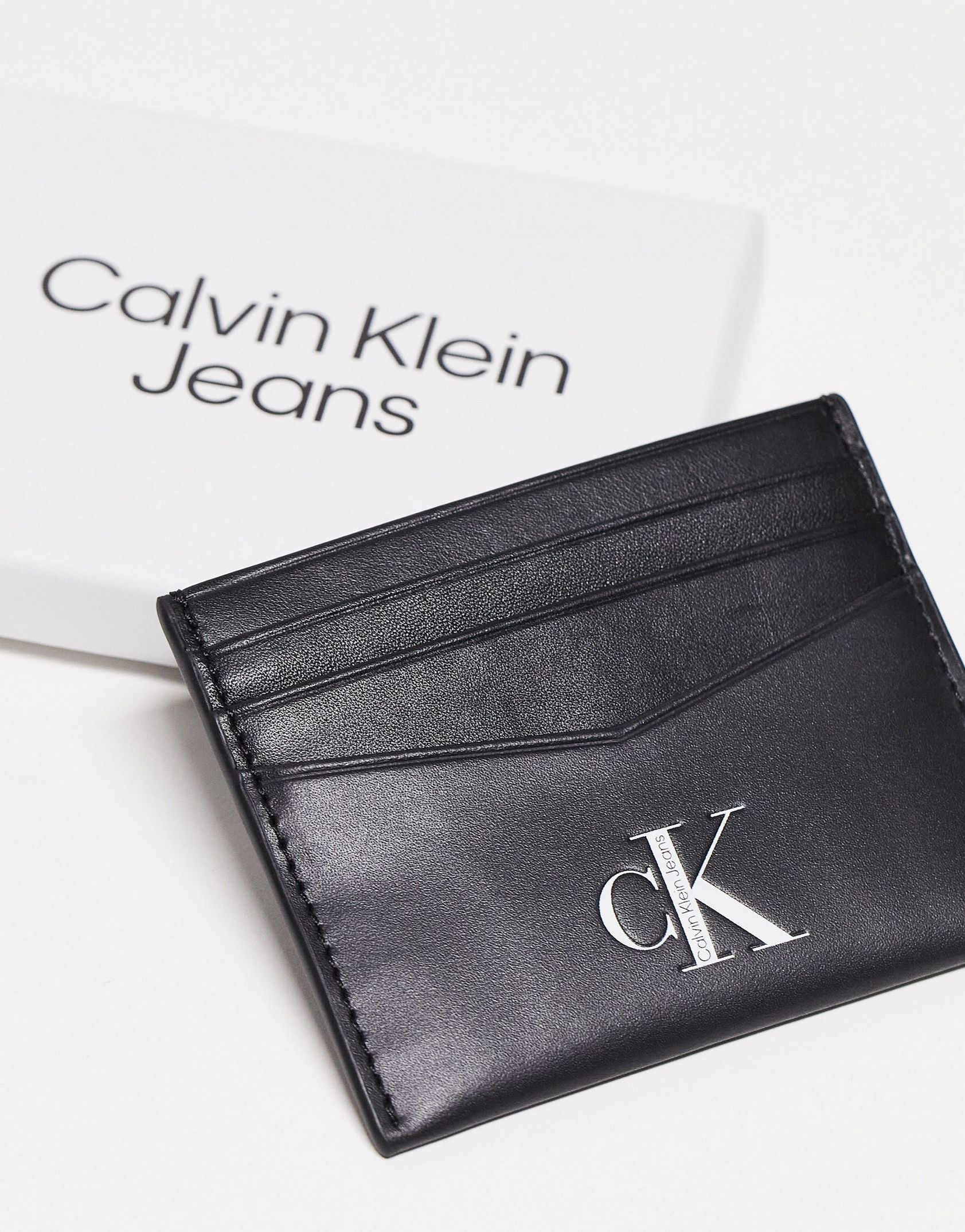 Calvin Klein Jeans leather card holder in black -  Price Checker