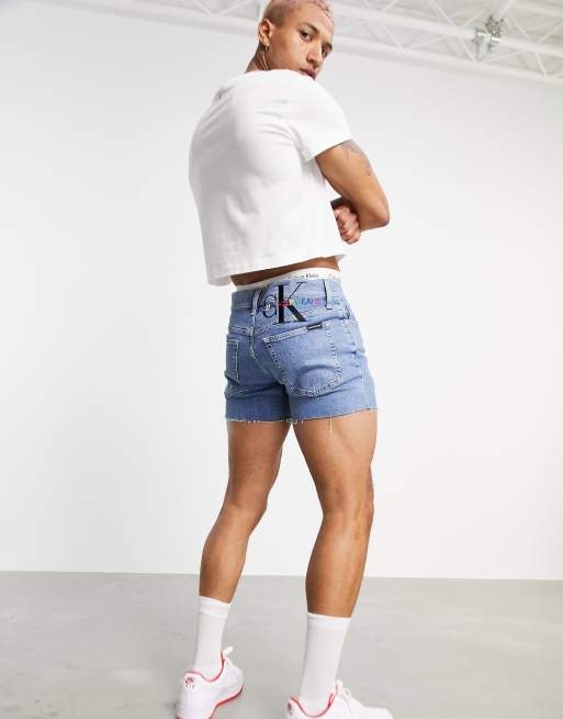 Calvin Klein Jeans Pride logo slim fit denim shorts in mid wash ASOS