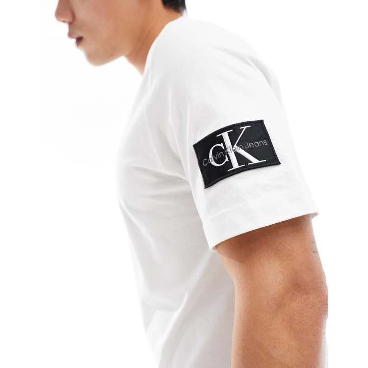 Calvin Klein Jeans regular badge t shirt in white ASOS