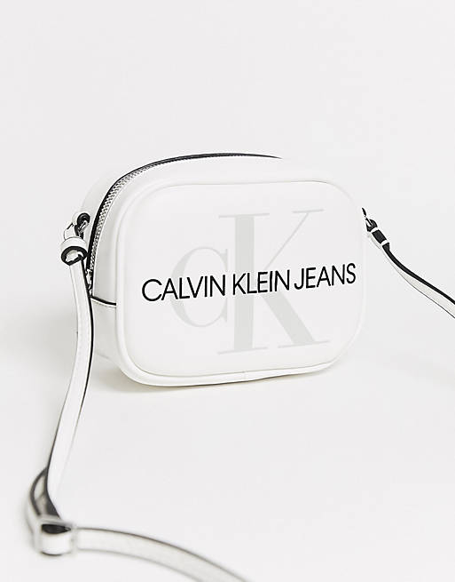 Calvin Klein Jeans reissue logo crossbody camera bag in white | ASOS