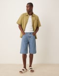 [Calvin Klein Jeans] Calvin Klein Jeans relaxed jorts in mid blue wash 28 Denim medium