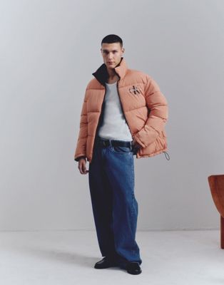 Calvin Klein Jeans reversible 90s puffer jacket in orange