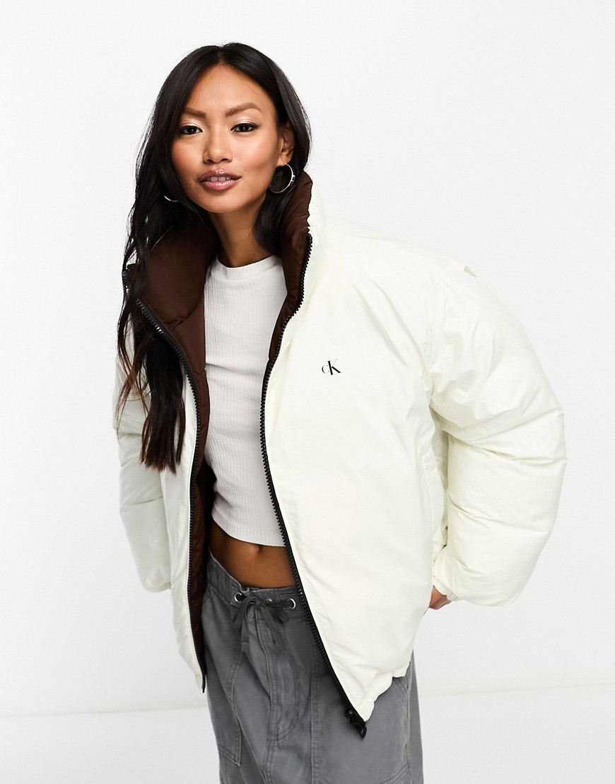 Calvin Klein Jeans reversible 90s puffer jacket in white/brown