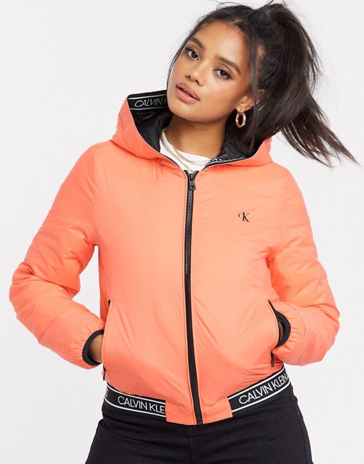 Calvin Klein Jeans reversible logo hooded padded jacket in pink