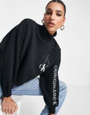 Calvin Klein Jeans roll neck front logo sweat in black | ASOS