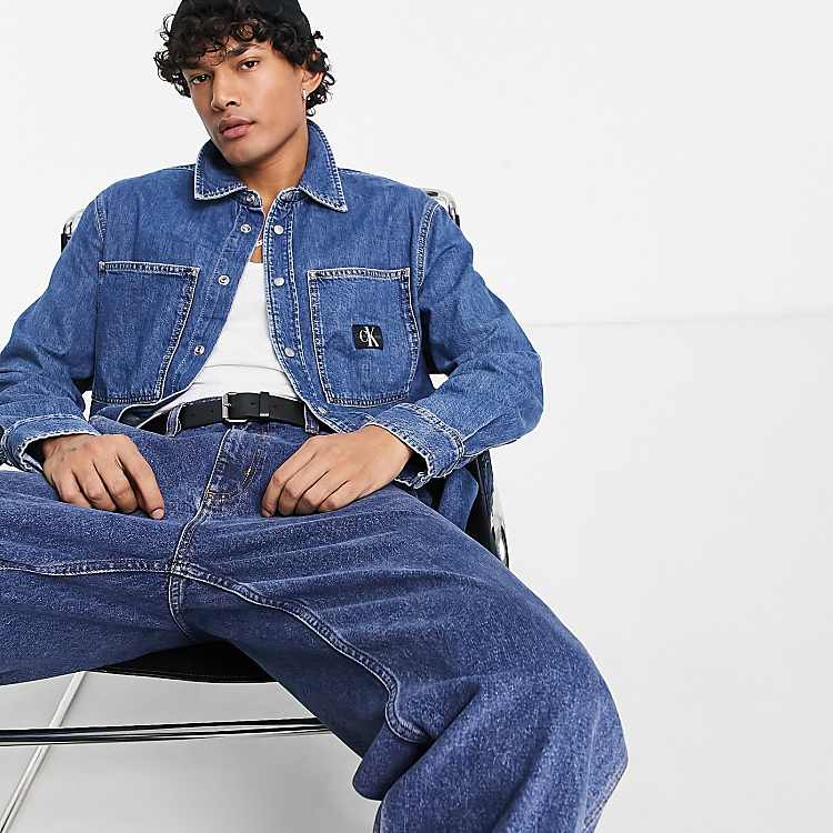 Calvin Klein Jeans - Ruimvallend denim overhemd met logo in mid-wash blauw  | ASOS calvin klein jeans