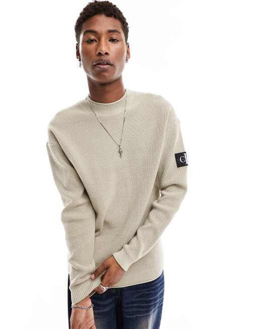Calvin Klein Jeans - Ruimvallende trui met badge in taupe