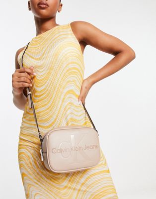 Calvin Klein Jeans industrial logo camera bag in beige - ASOS Price Checker