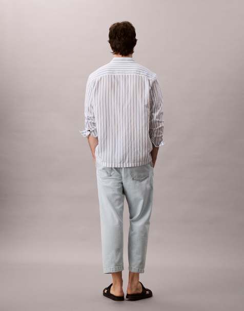 Calvin Klein Jeans – Schmal zulaufende Jeans im 90er-Stil in sonnengebleichter Waschung - view 1