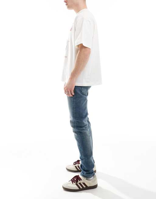 Calvin Klein Jeans – Schmale Karottenjeans in mittlerer Waschung, 3 von 5