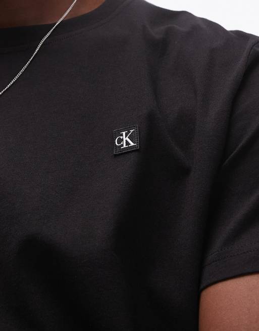 Calvin Klein Jeans – Schwarzes T-Shirt mit kleinem Logo , 4 von 4
