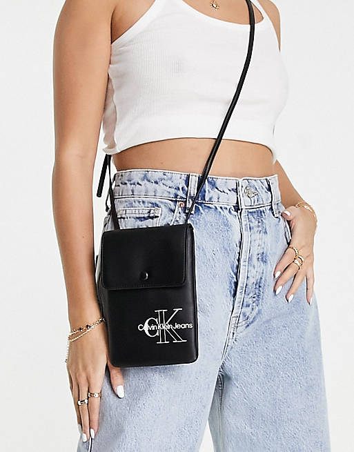 Calvin Klein Jeans sculpted phone crossbody bag in black | ASOS
