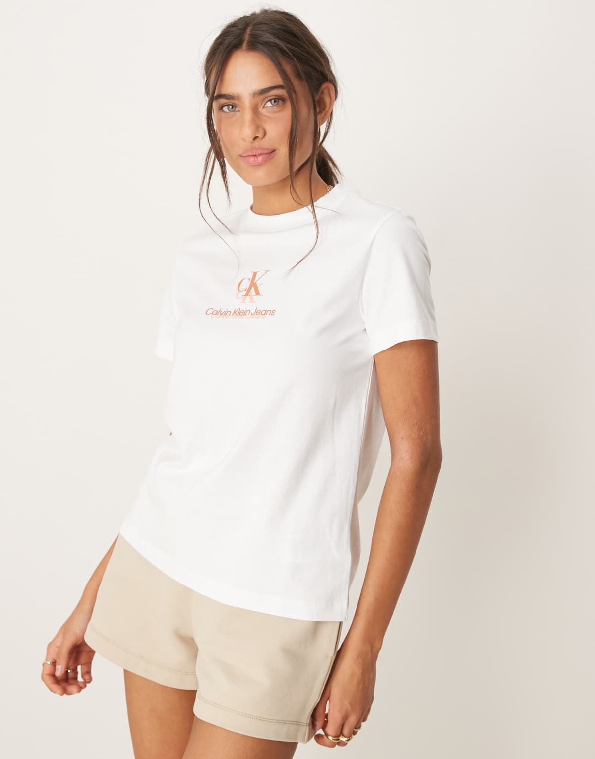 Calvin Klein Jeans shadow logo t-shirt in white and peach