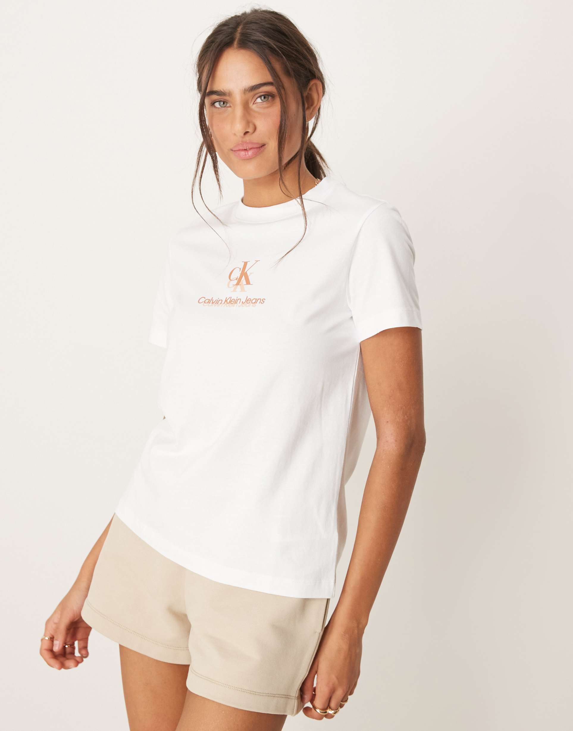 calvin klein jeans shadow logo t-shirt in white and peach