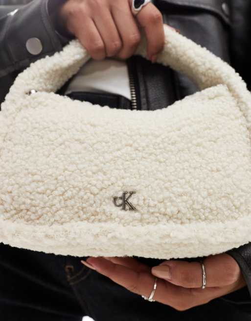 Calvin Klein Jeans sherpa mini zip bag in birch | ASOS