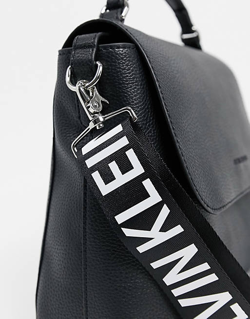 Calvin Klein Jeans shoulder bag with logo strap in white | ASOS