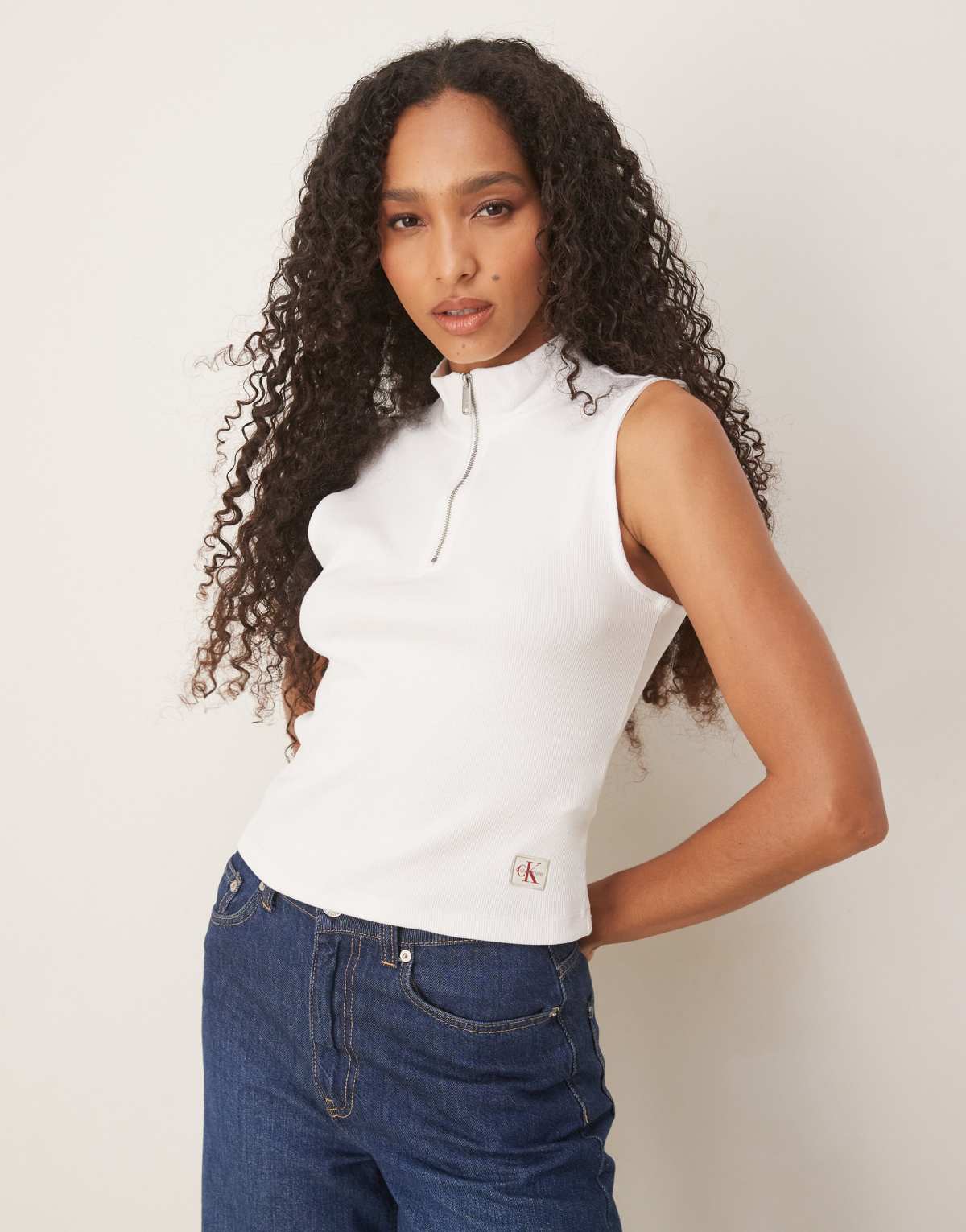 Calvin Klein Jeans sleeveless 1/4 zip logo polo top in white