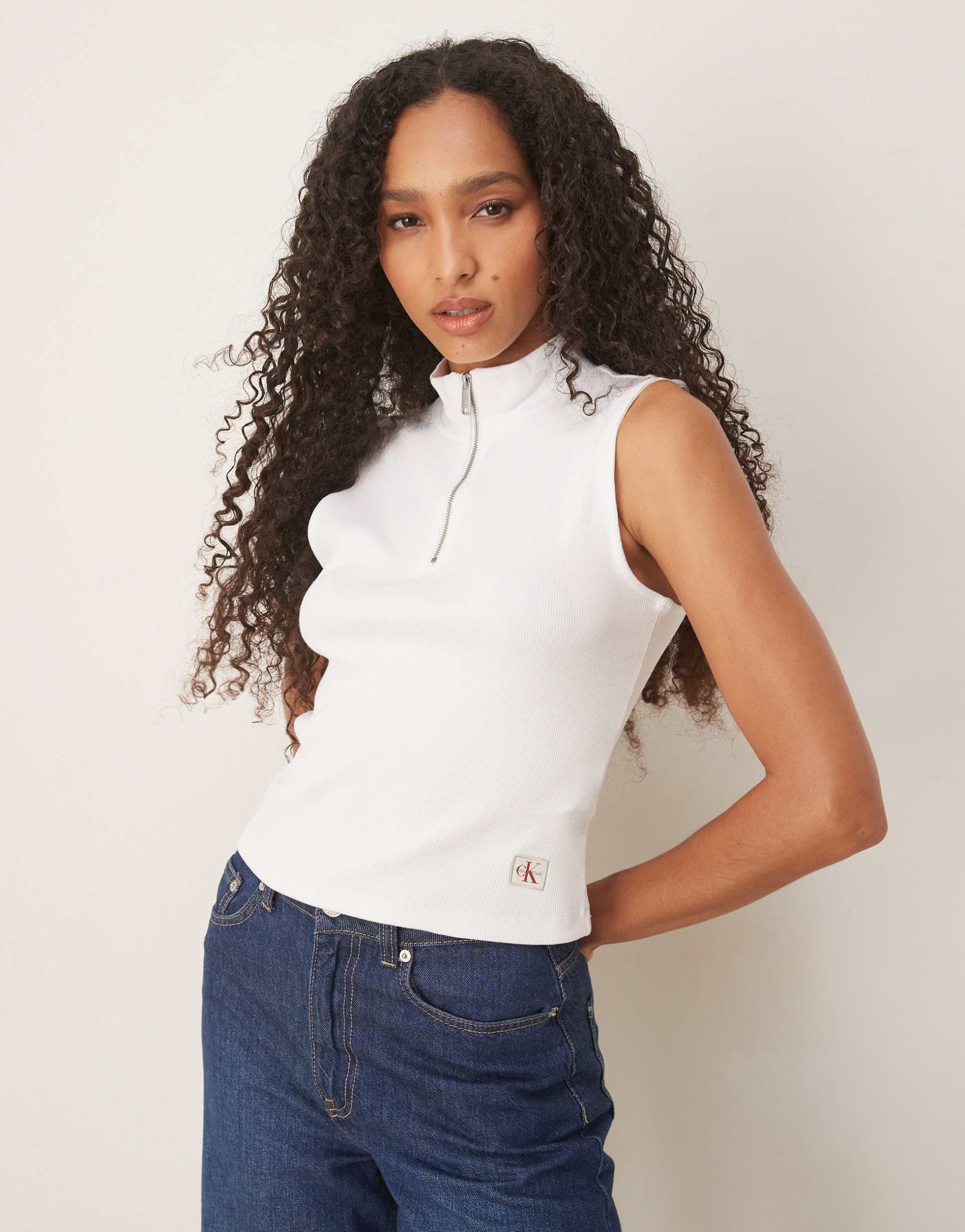 calvin klein jeans sleeveless 1/4 zip logo polo top in white