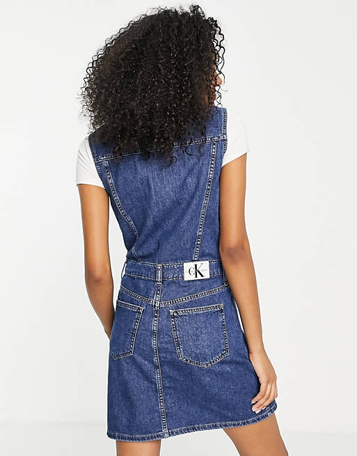 Calvin Klein Jeans sleeveless denim dress in mid wash | ASOS