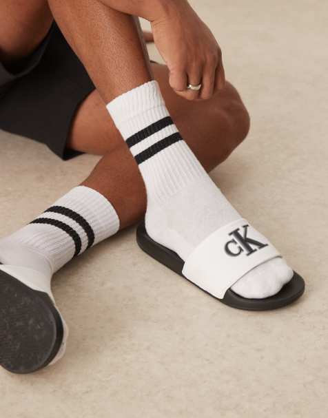 Calvin Klein Jeans - Sliders bianche e nere con logo - view 1