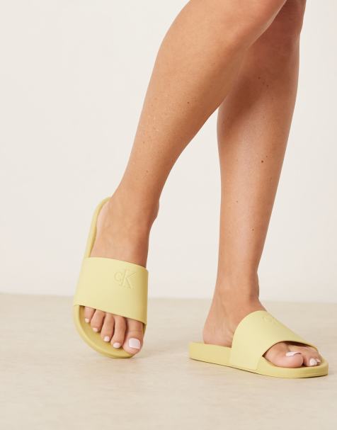 Calvin Klein Jeans - Sliders gialle con monogramma - view 1