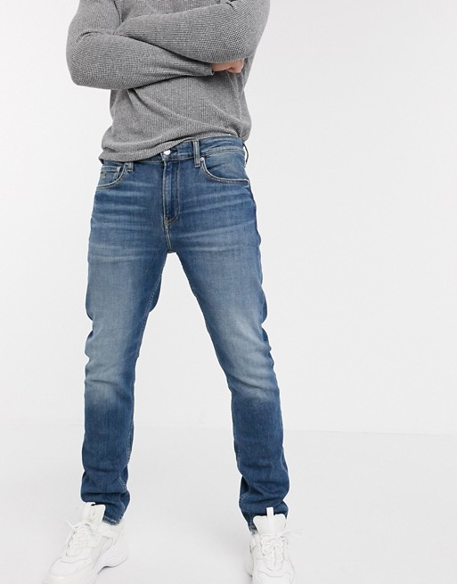 Calvin Klein Jeans slim taper dark wash jeans in blue