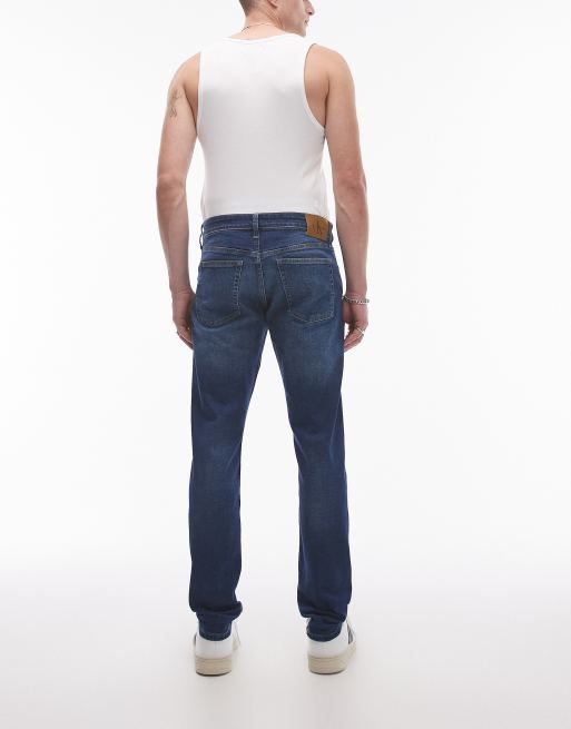 Calvin Klein Jeans slim taper jeans in mid wash, 2 of 5