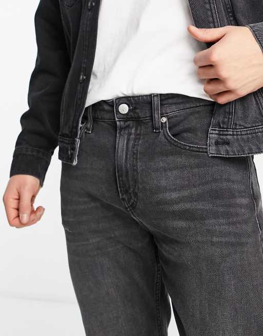 Calvin Klein Jeans slim tapered fit jeans in black wash | ASOS