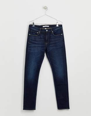 dark blue tapered jeans