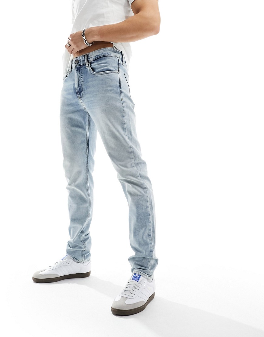 Calvin Klein Jeans slim tapered jeans in light wash-Blue