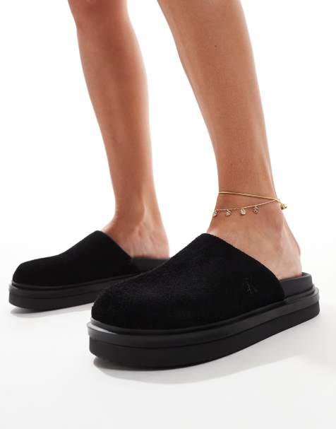 Calvin Klein Jeans slip on mules in black - view 1