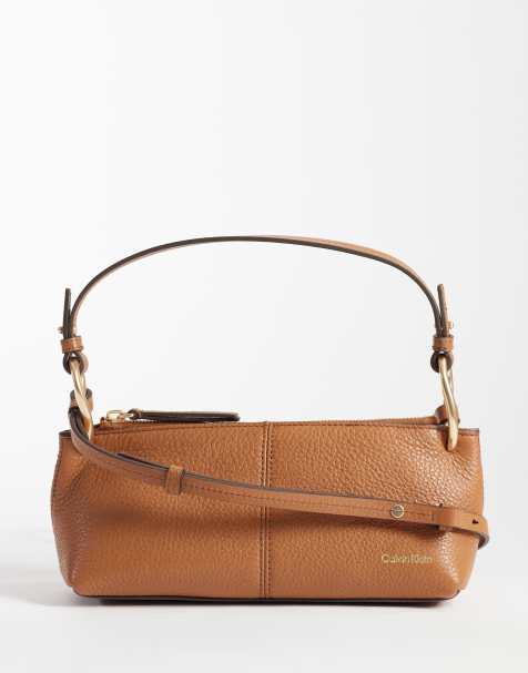 Calvin Klein Jeans slouchy leather bag with strap and gold details in tan - view 1