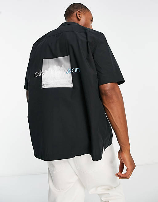 Calvin Klein Jeans splash photoprint back print short sleeve shirt in black  | ASOS