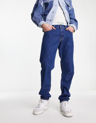 straight leg jeans in mid wash blue