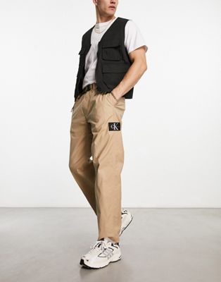 Calvin Klein Jeans straight leg utility chinos in beige - ASOS Price Checker