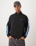 [Calvin Klein Jeans] Calvin Klein Jeans stripe track jacket in black and blue Chest 46 Black