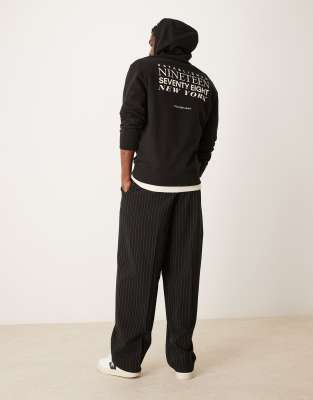 Calvin Klein Jeans - Sweat à capuche à texte imprimé au dos - Noir
