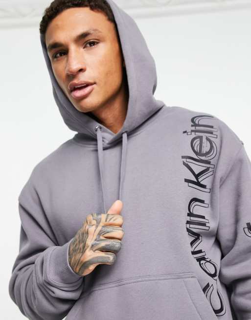 Calvin Klein Jeans - Sweat à capuche avec logo vertical audacieux - Gris
