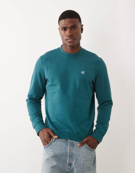 Calvin Klein Jeans – Sweatshirt in Blaugrün mit Rundhalsausschnitt und Grafikprint - view 1