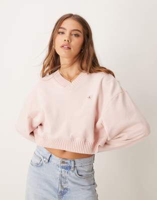 Calvin Klein Jeans - Sweatshirt in Rosa mit gewebtem Etikett und V-Ausschnitt