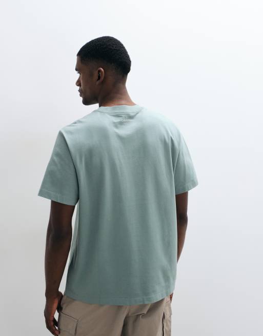 Calvin Klein Jeans – T-Shirt in Pistaziengrün mit mittigem Schriftzug, 4 von 5