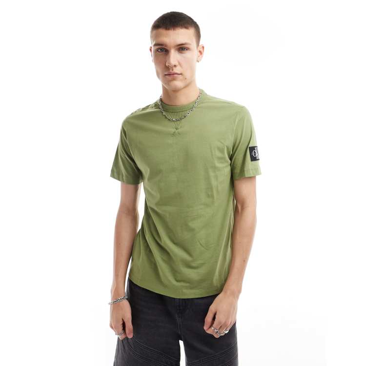 Calvin Klein Jeans | Calvin Klein Blå korta bad och löparshorts - T - shirt  vestibilità classica color ginepro con toppa - ClassicfuncenterShops
